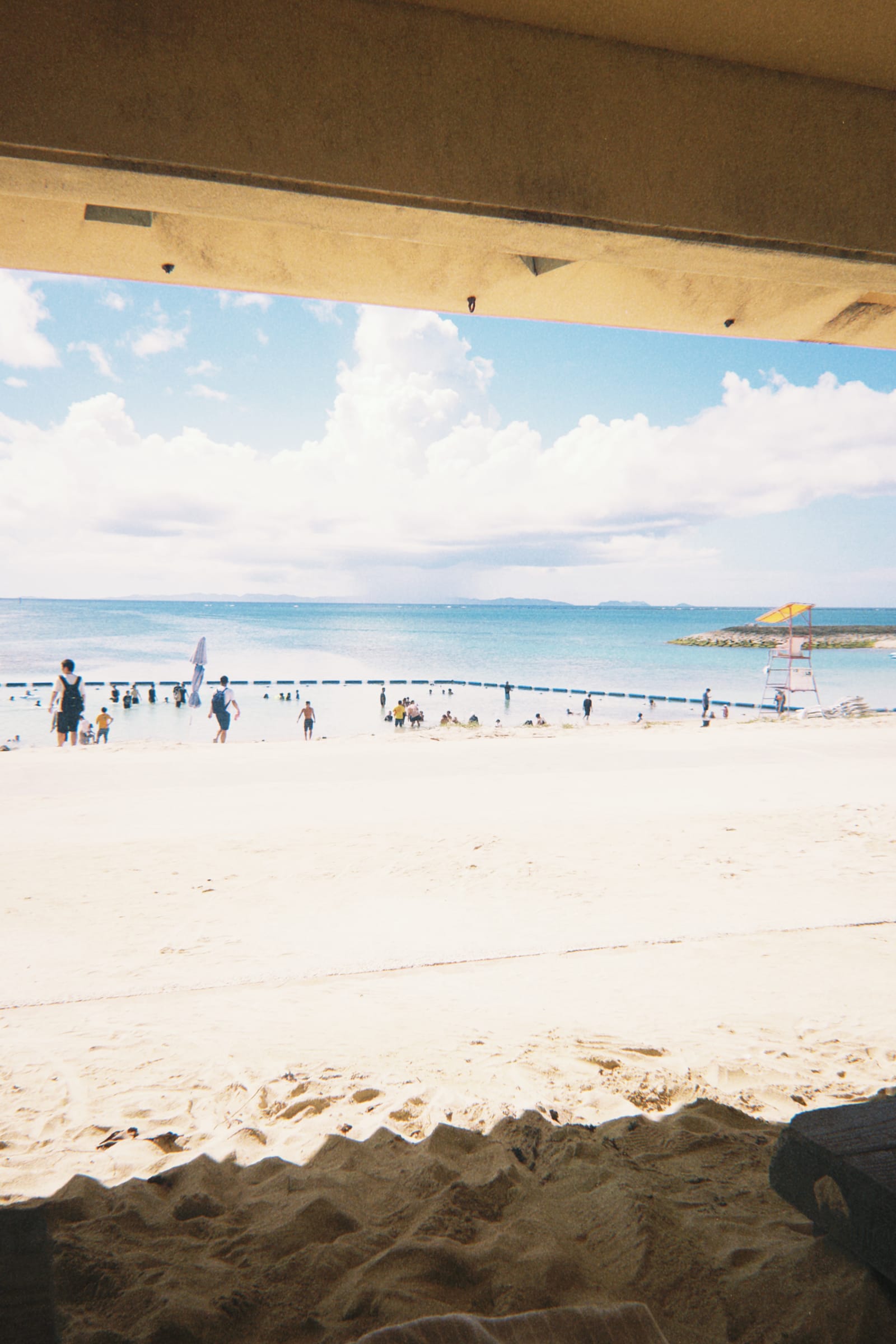A beach seen from the shade of a pavilion, Okinawa
