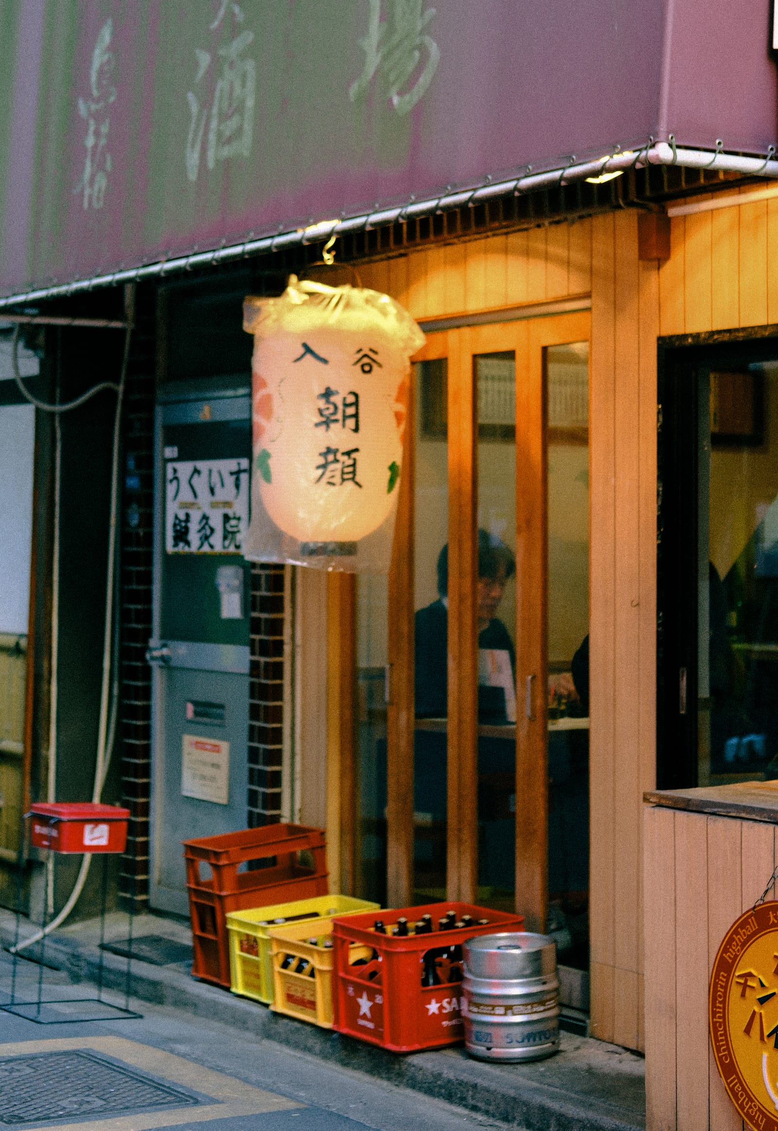 A lantern outside a small restaurant at night